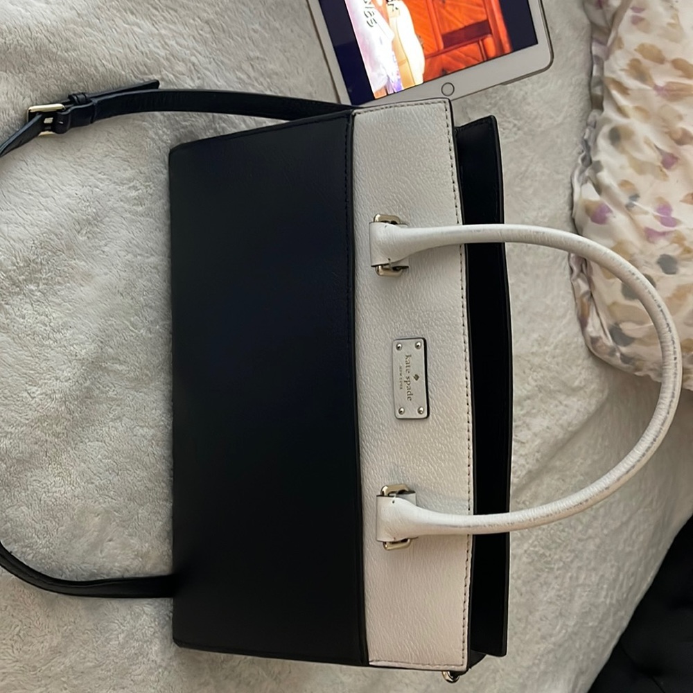 Kate spade purse. Black and white with cross body strap.